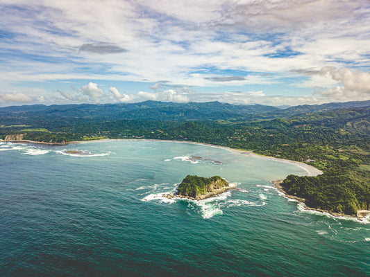 Tidal Whispers of Isla Chora - Aerial Samara Bay Wall Art Print | Blue Sea & Green Hills